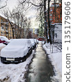 Cars Covered in Thick Snow After Blizzard in Residential Courtyard 135179606