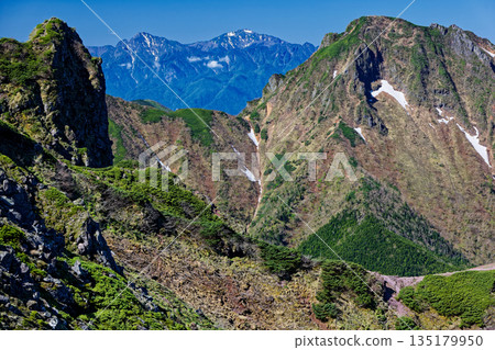 View of the rocky peaks of Yokodake, Mt. Amida, and the Southern Alps in the Yatsugatake Mountain Range 135179950