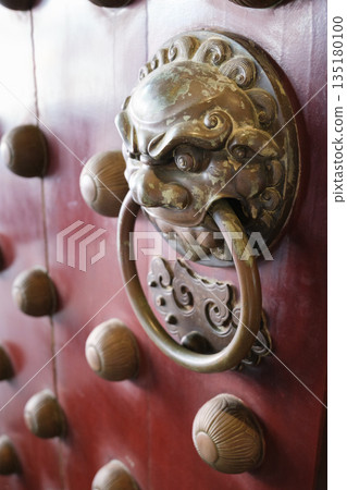 Beautiful entrance design of Buddha Tooth Relic Temple in Chinatown Singapore with ornate lion door knocker and traditional decorations Beautiful entrance design of Buddha Tooth Relic Temple in Chinatown Singapore with ornate lion door knocker and traditional decorations 135180100