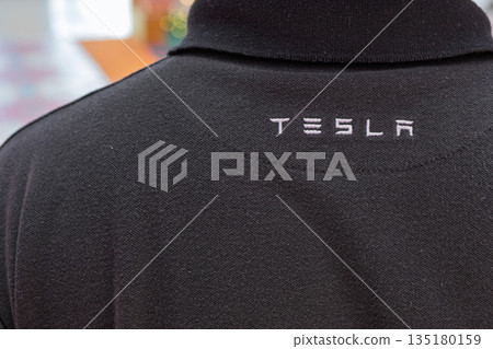 Tesla black polo shirt with logo displayed on the back Tesla black polo shirt with logo displayed on the back 135180159
