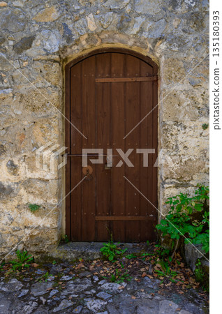 Old wooden doors in St. Hilarion Castle, Northern Cyprus Old wooden doors in St. Hilarion Castle, Northern Cyprus 135180393