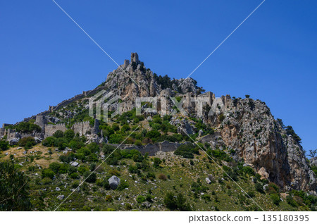 St. Hilarion Castle, a medieval fortress in Northern Cyprus, offers stunning views of the Kyrenia region and the Mediterranean Sea. 135180395