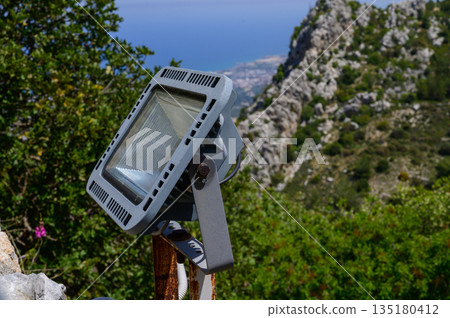 Modern LED spotlight mounted on the wall of St. Hilarion Castle Modern LED spotlight mounted on the wall of St. Hilarion Castle 135180412
