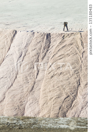 Trucks unloading raw salt bulk, Salinas Grandes de Hidalgo, La Pampa, Argentina. 135180483
