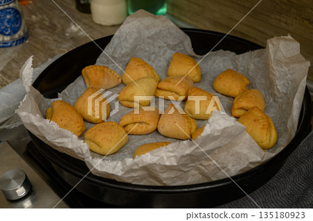 Homemade Goose Feet Pastries Fresh from Oven on Parchment Homemade Goose Feet Pastries Fresh from Oven on Parchment 135180923