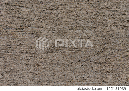 Texture of weathered concrete with intricate patterns under warm afternoon sunlight revealing nature's subtle artistry Texture of weathered concrete with intricate patterns under warm afternoon sunlight revealing nature's subtle artistry 135181089