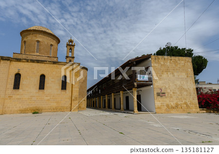 Historic stone architecture stands proudly in a quaint village square under a vibrant sky Historic stone architecture stands proudly in a quaint village square under a vibrant sky 135181127