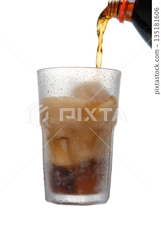 Coca-Cola Pouring Action into Glass with Ice on White Background Coca-Cola Pouring Action into Glass with Ice on White Background 135181606