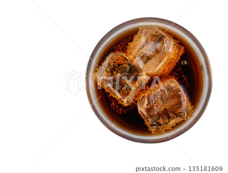 Overhead Shot of Coca-Cola Glass with Ice on White Backdrop Overhead Shot of Coca-Cola Glass with Ice on White Backdrop 135181609