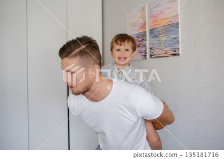 Smiling Father Playing with Happy Toddler Smiling Father Playing with Happy Toddler 135181716