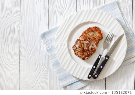 Fried Medium Rare Beef Steak on White Plate Fried Medium Rare Beef Steak on White Plate 135182071