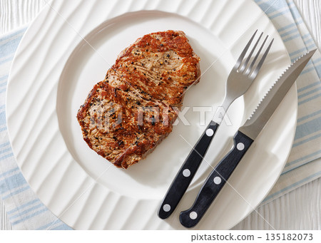 Fried Medium Rare Beef Steak on White Plate 135182073