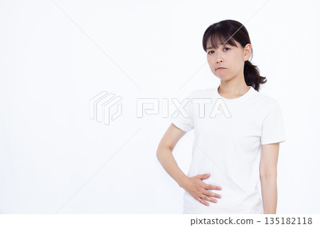 A woman hurting tummy A woman hurting tummy 135182118
