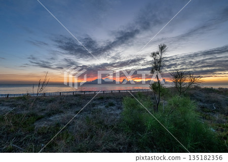 sunrise romantic couple on Corsican coast near Bastia Etang de Biguglia Camping San Daminao Beachside Corse sunrise romantic couple on Corsican coast near Bastia Etang de Biguglia Camping San Daminao Beachside Corse 135182356