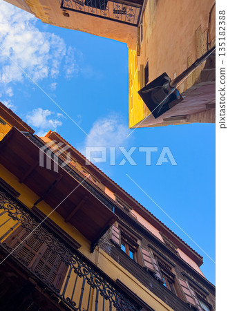 Old town buildings framing blue sky, chania crete Old town buildings framing blue sky, chania crete 135182388