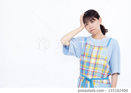 A woman with a headache 135182400