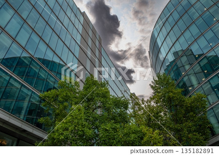 Glass Facades Of Modern Office Buildings In The Financial District Of London In Great Britain Glass Facades Of Modern Office Buildings In The Financial District Of London In Great Britain 135182891