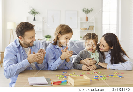 Family With Kids Learning And Playing Together At Home Family With Kids Learning And Playing Together At Home 135183170