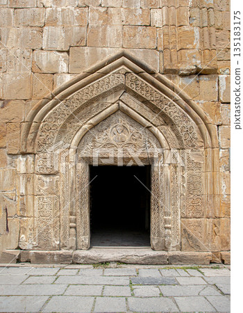Ananuri complex church portal with intricate stone carvings 135183175