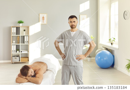 Manual therapy rehabilitation, male physical therapist in manipulative therapy medical clinic room 135183184