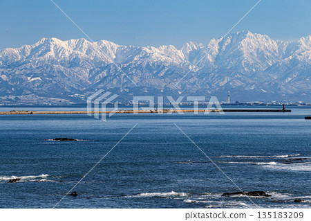 Tateyama mountain range seen over the ocean Tateyama mountain range seen over the ocean 135183209