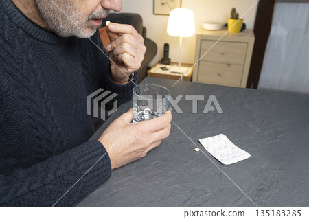 taking a pill taking a pill 135183285