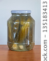 Homemade pickled cucumber in glass jar. 135183413