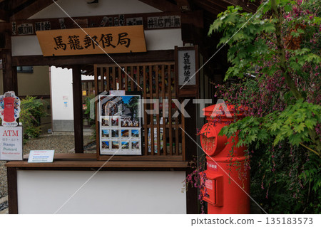 The charming streets and red postboxes of Magome-juku in Gifu Prefecture 135183573