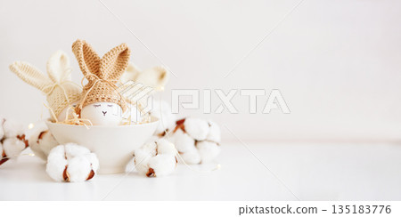 Easter Eggs with Bunny Hats in Cozy Spring Arrangement 135183776