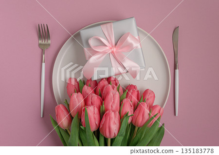Gift Box with Tulips on Plate. Festive Romantic Flatlay Gift Box with Tulips on Plate. Festive Romantic Flatlay 135183778