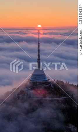 Beautiful Sunset over Famous Mountain Hotel Jested , Aerial Shot Above Clouds Beautiful Sunset over Famous Mountain Hotel Jested , Aerial Shot Above Clouds 135184334