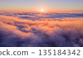 Beautiful Sunset with Purple Tint , Aerial Shot Above Clouds 135184342