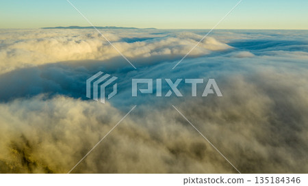 Beautiful Sunset with Purple Tint , Aerial Shot Above Clouds Beautiful Sunset with Purple Tint , Aerial Shot Above Clouds 135184346