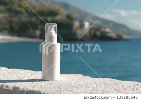 A white bottle with a cream dispenser stands on a white surface, with the sea and mountains in the background. Clean template for brand presentation. 135185648