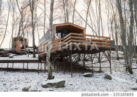cluster of elevated modular cabins connected by walkways cluster of elevated modular cabins connected by walkways 135185693