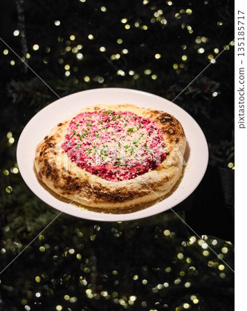 Gourmet Neapolitan pizza plated for romantic bistro date 135185717