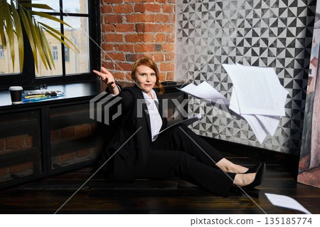 Caucasian executive tosses papers in dramatic resignation moment Caucasian executive tosses papers in dramatic resignation moment 135185774