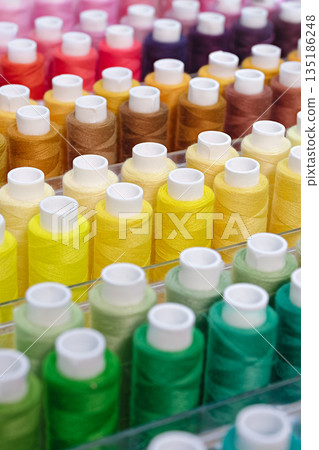 Many spools of thread of different colors Many spools of thread of different colors 135186248