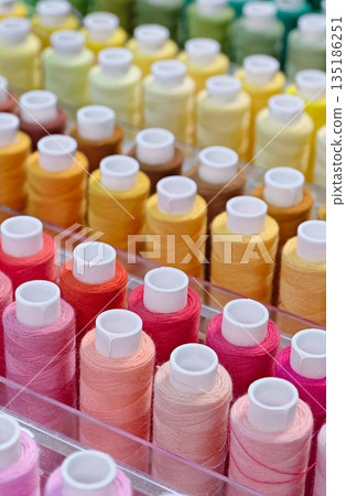 Many spools of thread of different colors Many spools of thread of different colors 135186251