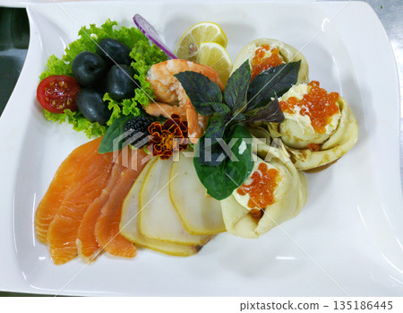 salmon, butterfish, shrimp tails and tartlets with red caviar 135186445