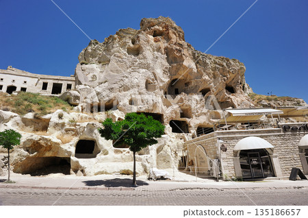 houses cut into the rocks in Cappadocia, Turkey houses cut into the rocks in Cappadocia, Turkey 135186657