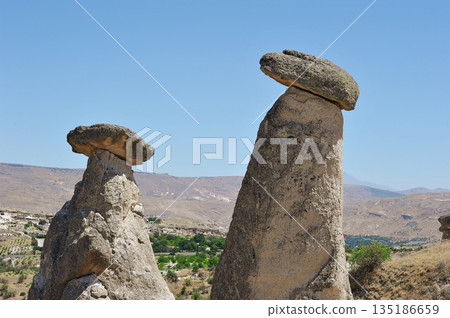 "Three Beauties" are rock formations located near the city of Urgup in Cappadocia 135186659