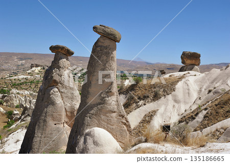 "Three Beauties" are rock formations located near the city of Urgup in Cappadocia "Three Beauties" are rock formations located near the city of Urgup in Cappadocia 135186665