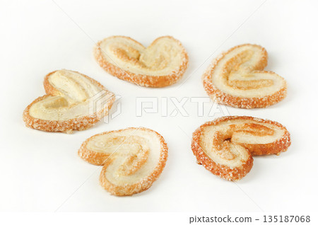 cookies in the shape of an ear on a white background cookies in the shape of an ear on a white background 135187068