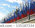 festive decoration with Russian flags on Manezhnaya Square in Moscow 135187334