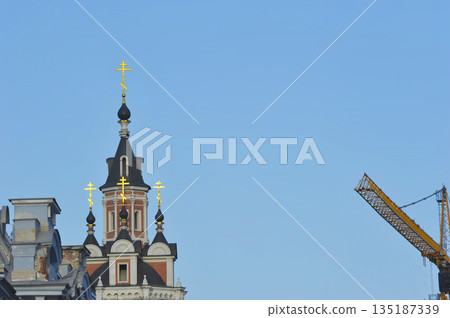 view of the Spassky Cathedral and construction crane in Moscow view of the Spassky Cathedral and construction crane in Moscow 135187339