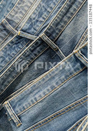 A stack of blue stonewashed jeans A stack of blue stonewashed jeans 135187448
