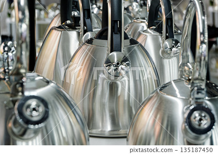 Many stainless steel kettles 135187450