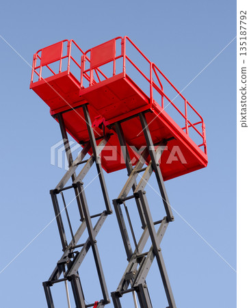 Group of red scissor lifts Group of red scissor lifts 135187792