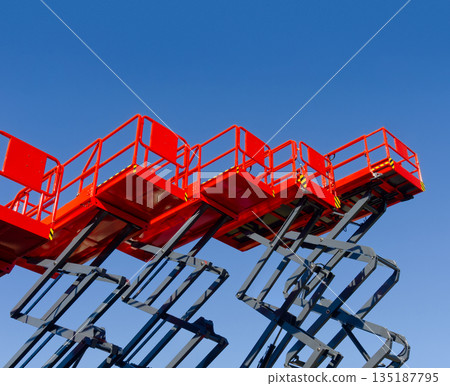 Group of red scissor lifts Group of red scissor lifts 135187795